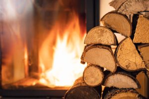 Firewood stack in front of stove